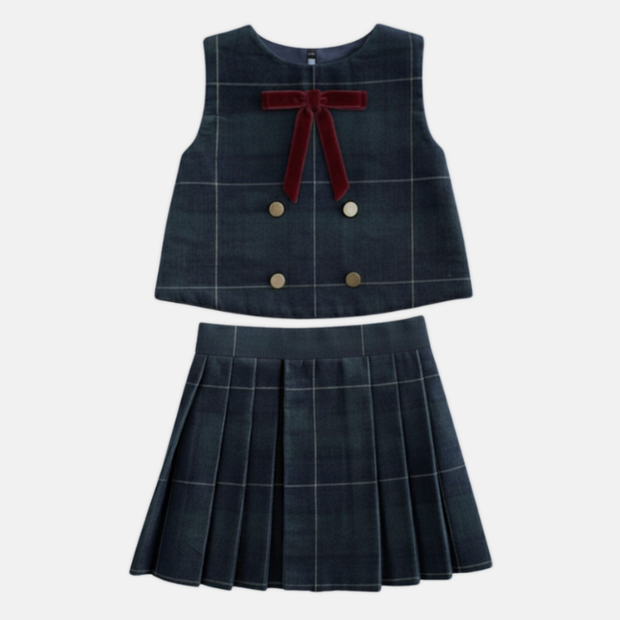 Plaid corduroy dress with a red bow on a white background