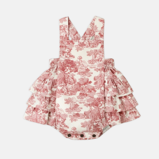 red toile ruffled romper on a white background