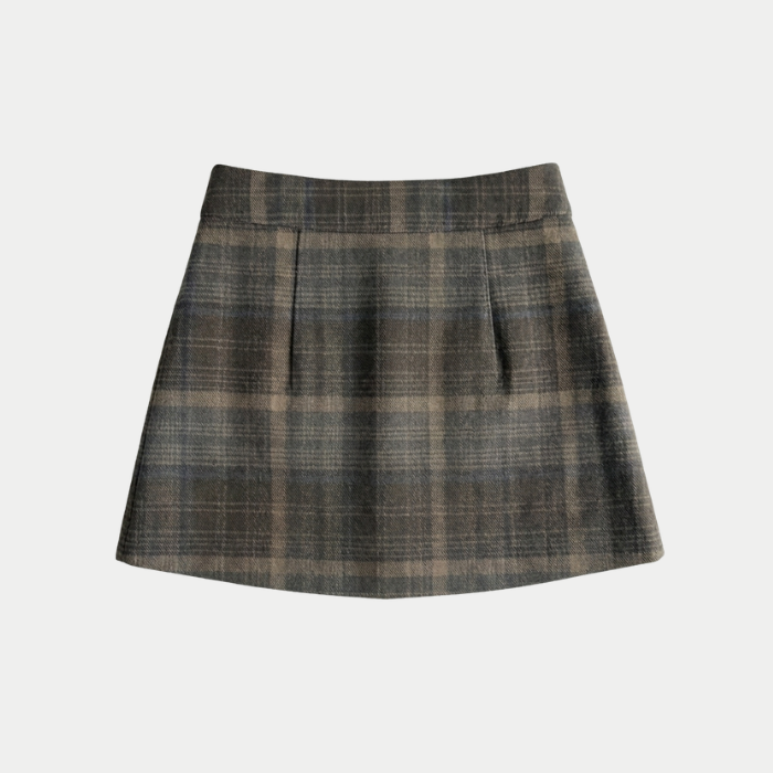 A plaid mini skirt in a muted brown, gray, and beige pattern, shown flat against a light gray background.