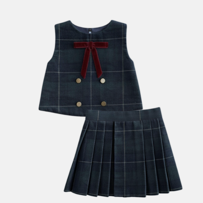 Navy checkered top with a bow and pleated skirt on a white background