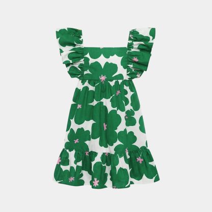 A green and white clover patterned dress with ruffled shoulder straps and a tiered skirt, shown against a light gray background.