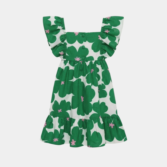 A green and white clover patterned dress with ruffled shoulder straps and a tiered skirt, shown against a light gray background.