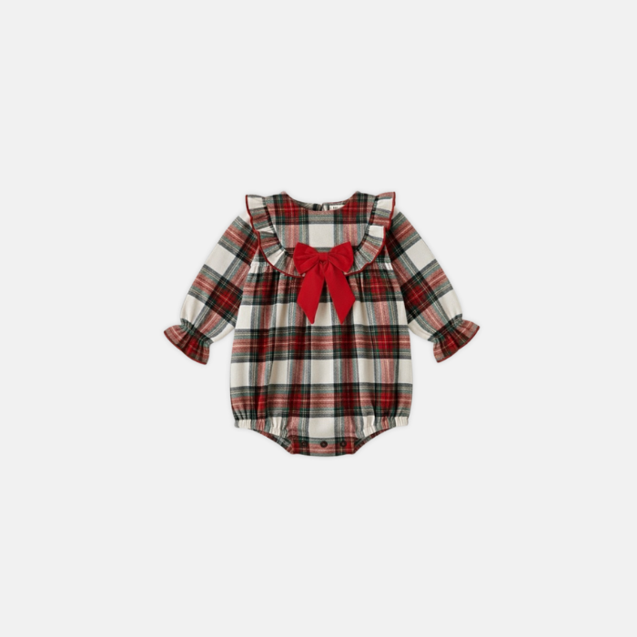 Plaid baby romper with a red bow on a white background