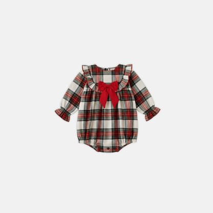 Plaid baby romper with a red bow on a white background