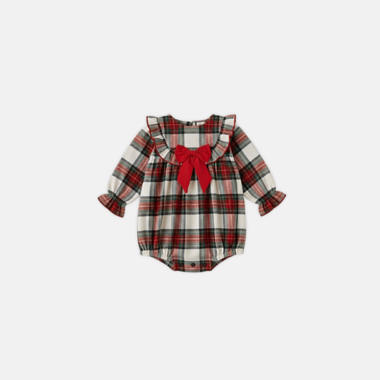 Plaid baby romper with a red bow on a white background