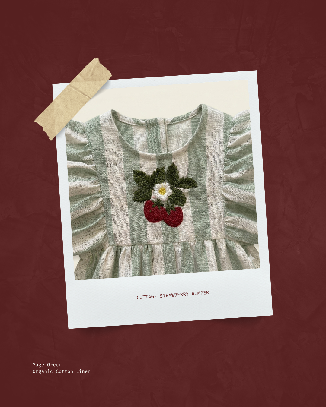 Children's dress with strawberry design on a white card against a red background