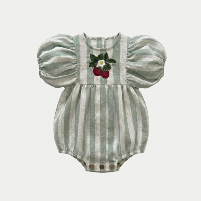 Striped sage romper with puff sleeves and strawberry embroidery design on a light gray background