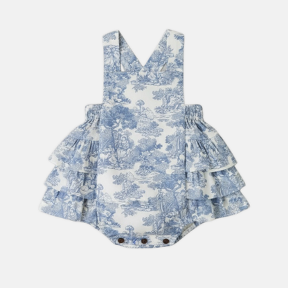 Blue and white toile romper on a white background