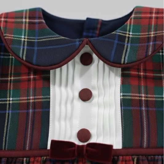 Plaid dress with a collar and buttons on a plain background