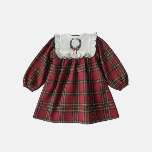 Red plaid dress with white collar on a light gray background